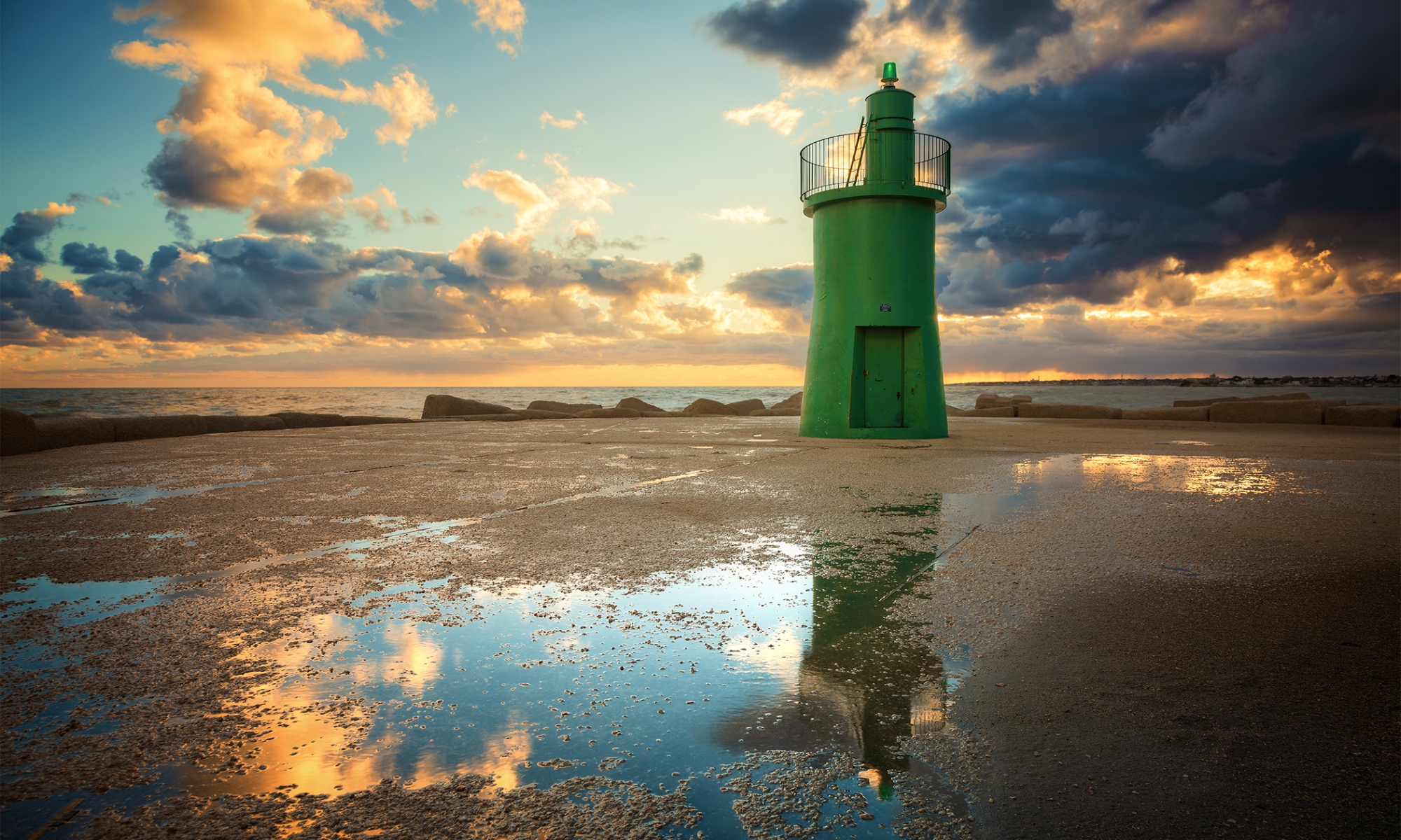 The Green Lighthouse placed in Trani dunring the first sunrise of the 2019 year.